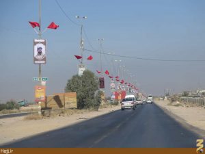 نصب تصاویر شهدای مدافع حرم در مسیر نجف تا کربلا